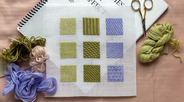 Advanced needlepoint stitches displayed on a single canvas with threads, scissors, and a notebook, ideal for creative needlepoint patterns