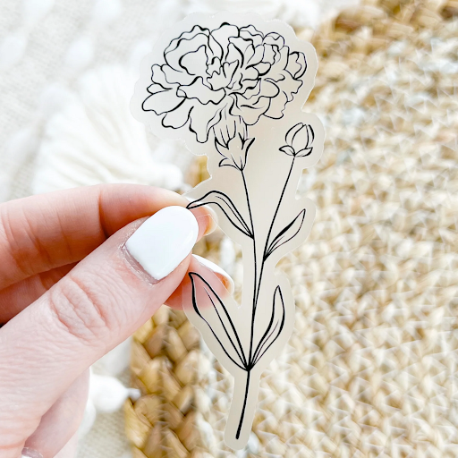 Floral needlepoint canvas showing outlined petals and leaves, used to demonstrate how different needlepoint stitches bring flowers to life