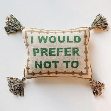 Decorative needlepoint pillow with stitched quote, a handmade pillow design that adds charm and warmth to modern home décor.